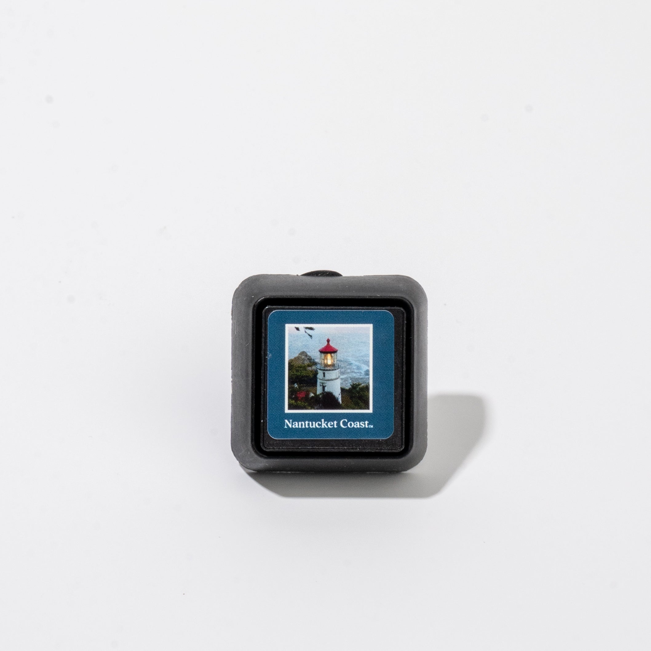 Square Auto Vent Clip-Nantucket Coast car air freshener featuring a lighthouse on a cliff.